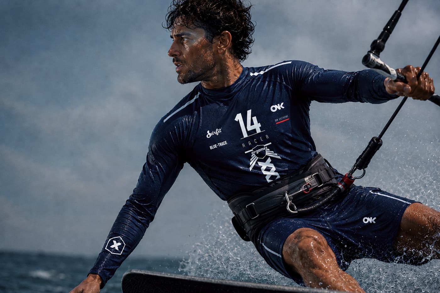 ONX athlete kitesurfing in the Racer 2026 signature wetshirt